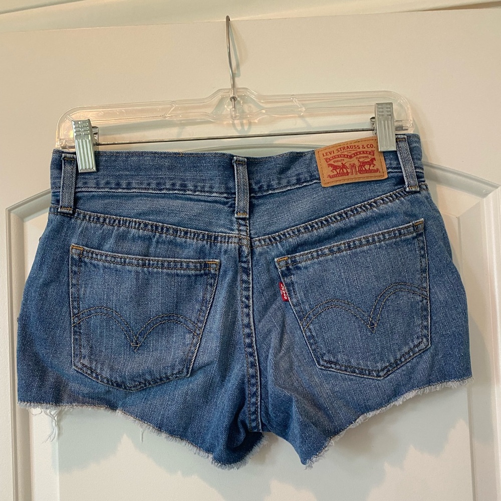 Levi’s size 26 distressed shorts 100% cotton with stud detail